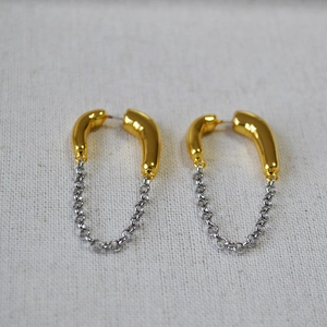 Modern two-tone chain tassel earrings with gold curved tubes and silver U-shaped loops