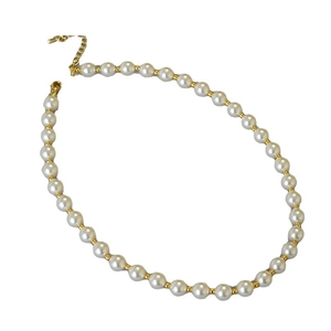 Elegant pearl necklace with gold spacer beads and adjustable lobster clasp on white background