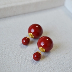 French vintage style red double pearl earrings with gold metal stems on jewelry box