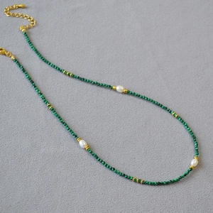Detail of French vintage malachite beaded necklace with pearls and gold lobster clasp