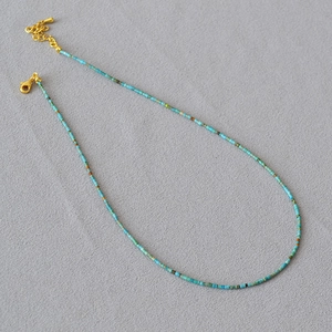 Minimalist turquoise beaded choker necklace with gold-plated lobster clasp and extension chain