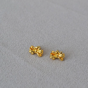 Elegant gold bow earrings for women in polished brass with 925 silver needles