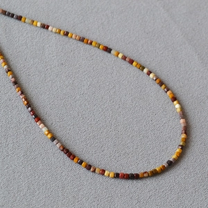 Minimalist French Alashan stone necklace with colorful square beads in earth tones