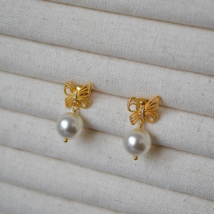 Elegant gold bow earrings with shimmering zircon stones and round white pearls for women