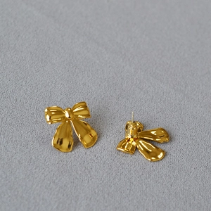 Chic 18K gold plated bow-knot stud earrings featuring a glossy minimalist design
