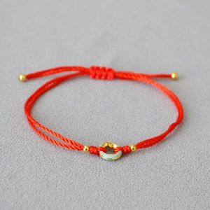 Adjustable red woven cord bracelet with blue ring pendant and gold beads for women
