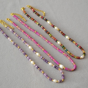 Three colorful beaded necklaces with freshwater rice pearls and gold lobster clasps