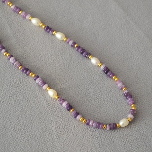 Handmade necklace with purple amethyst discs, white rice pearls and gold spacer beads