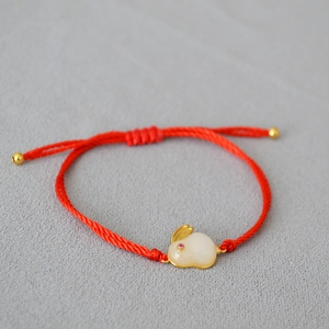 Adjustable red rope bracelet with rabbit jade pendant and gold beads for good luck