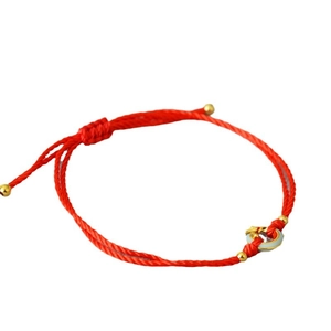 Traditional red string bracelet with gold beads and round jade-style pendant