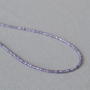 Elegant purple faceted cube crystal necklace with a minimalist transparent texture