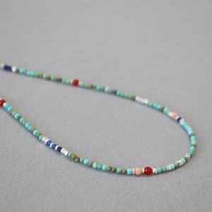 Bohemian turquoise beaded necklace with colorful stones and silver metal accents