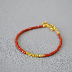 Minimalist red agate beaded bracelet with faceted stones and golden hex spacer beads