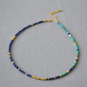 Handmade beaded necklace with blue lapis lazuli, turquoise, and silver accents