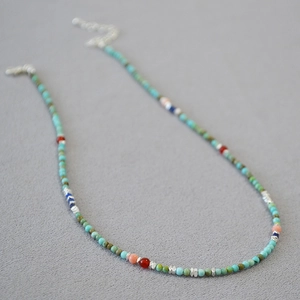 Bohemian turquoise beaded necklace with red agate accents and silver lobster clasp