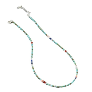 Bohemian turquoise handmade beaded necklace with retro colorful accents on white background