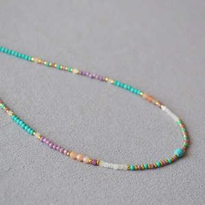 Handcrafted necklace with turquoise, purple mica and pastel beads with gold accents