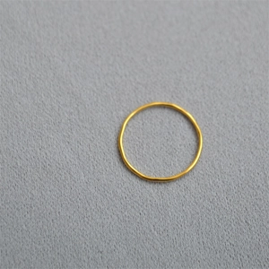 Minimalist thin gold ring with smooth metallic luster, ideal for layering or solo wear