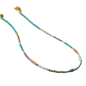 Handmade beaded necklace with turquoise, pink, and purple beads and yellow tassels