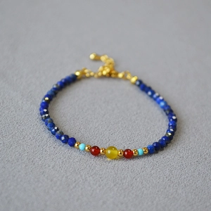 Macro detail of multicolored beads necklace featuring lapis and turquoise stones