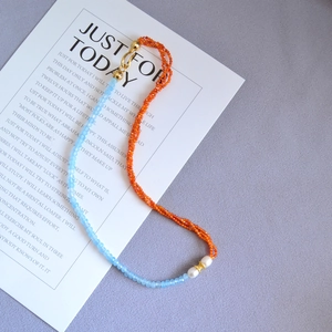 Blue and orange gemstone beaded necklace with freshwater pearl and gold clasp