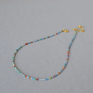Minimalist rainbow beaded necklace with multi-color cubic zirconia and gold-plated chain