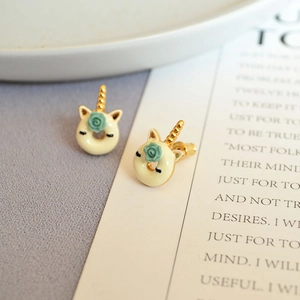 Handmade enamel unicorn donut earrings with green rose detail and gold accents