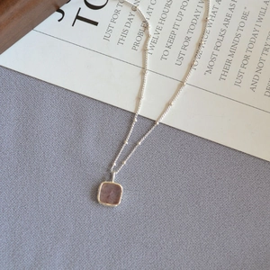 Elegant silver bead chain necklace featuring a square translucent aquamarine-style pendant