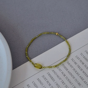 Minimalist olive green beaded elastic bracelet with sparkling zircon and gold accent