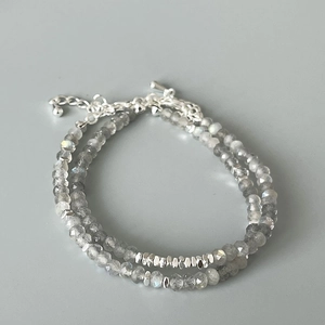 Detail of faceted grey moonstone and silver beads bracelet with lobster clasp