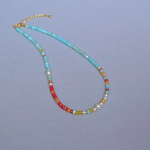 Colorful Amazonite bead necklace with vibrant red accents and pearls for summer outfits