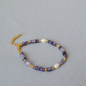 Detail of purple amethyst beads and freshwater pearls on an elegant vintage bracelet