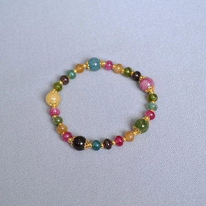 Handmade colorful tourmaline beaded stretch bracelet with gold-plated hollow floral spacers