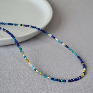 Lapis lazuli beaded necklace with crystal accents and gold spacers in Van Gogh style