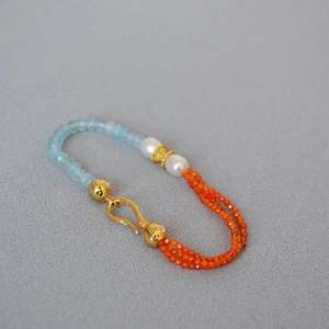 Detailed macro of vintage gemstone beaded necklace with pearls and blue faceted stones