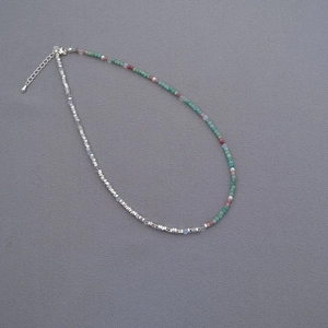 French vintage beaded necklace with turquoise, pearls and silver beads on grey fabric