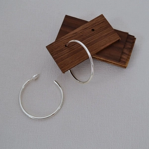 Minimalist silver plated brass geometric C-shape hoop earrings with a polished finish