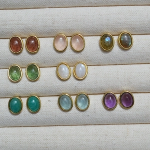 Elegant gold-plated oval stud earrings with colorful natural stones in jewelry display box