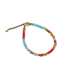 Colorful amazonite beaded necklace with pearls and gold lobster clasp on white background