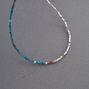 Detailed close-up of Monet inspired beaded necklace with silver chips and pearls
