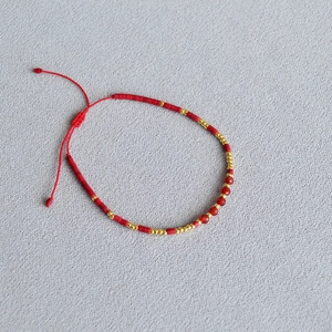 Bohemian handmade red beaded bracelet with natural stones and adjustable woven cord
