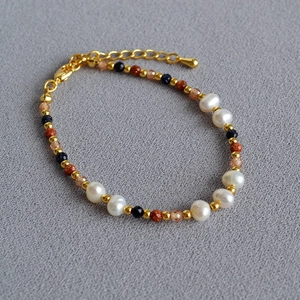 Baroque pearl bracelet with blue goldstone beads and adjustable gold chain link