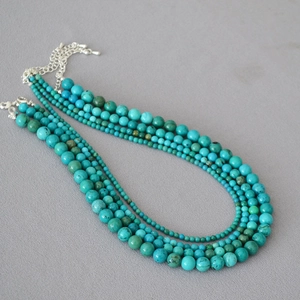 Detail showing natural turquoise multi-layer beaded necklace with silver extension chain