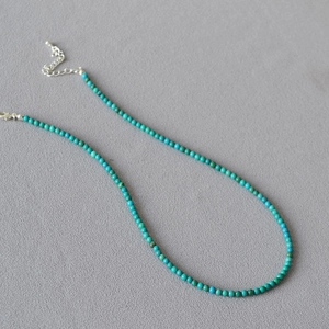 Minimalist turquoise beaded necklace with adjustable silver lobster clasp and extension chain
