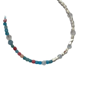 French style colorful beaded necklace with silver accents and natural stones on white back
