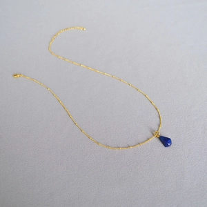 Lapis lazuli faceted rhombus pendant on a golden satellite chain necklace for women