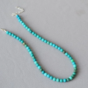 Minimalist turquoise beaded choker necklace with adjustable silver lobster clasp closure