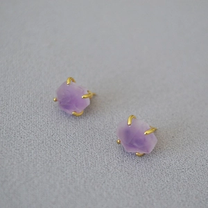 Gold plated brass earrings featuring natural irregular purple amethyst in a four-claw setting