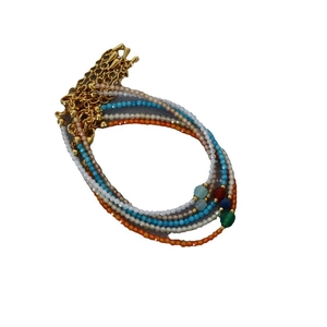 Colorful Bohemian style stacked bead bracelets with golden lobster clasp and faceted stones