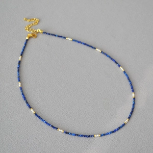 Vintage French beaded necklace with blue lapis and pearls featuring gold accents